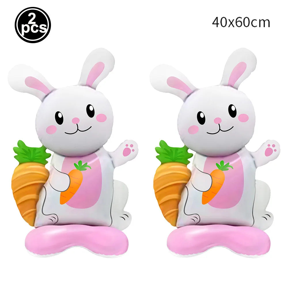 Two white cartoon bunny foil balloons holding carrots