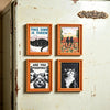 Four framed prints featuring cats, including a black cat, two cats looking at the viewer, and a striped cat.