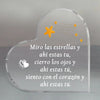 A clear heart-shaped glass keepsake with engraved text and gold star accents.