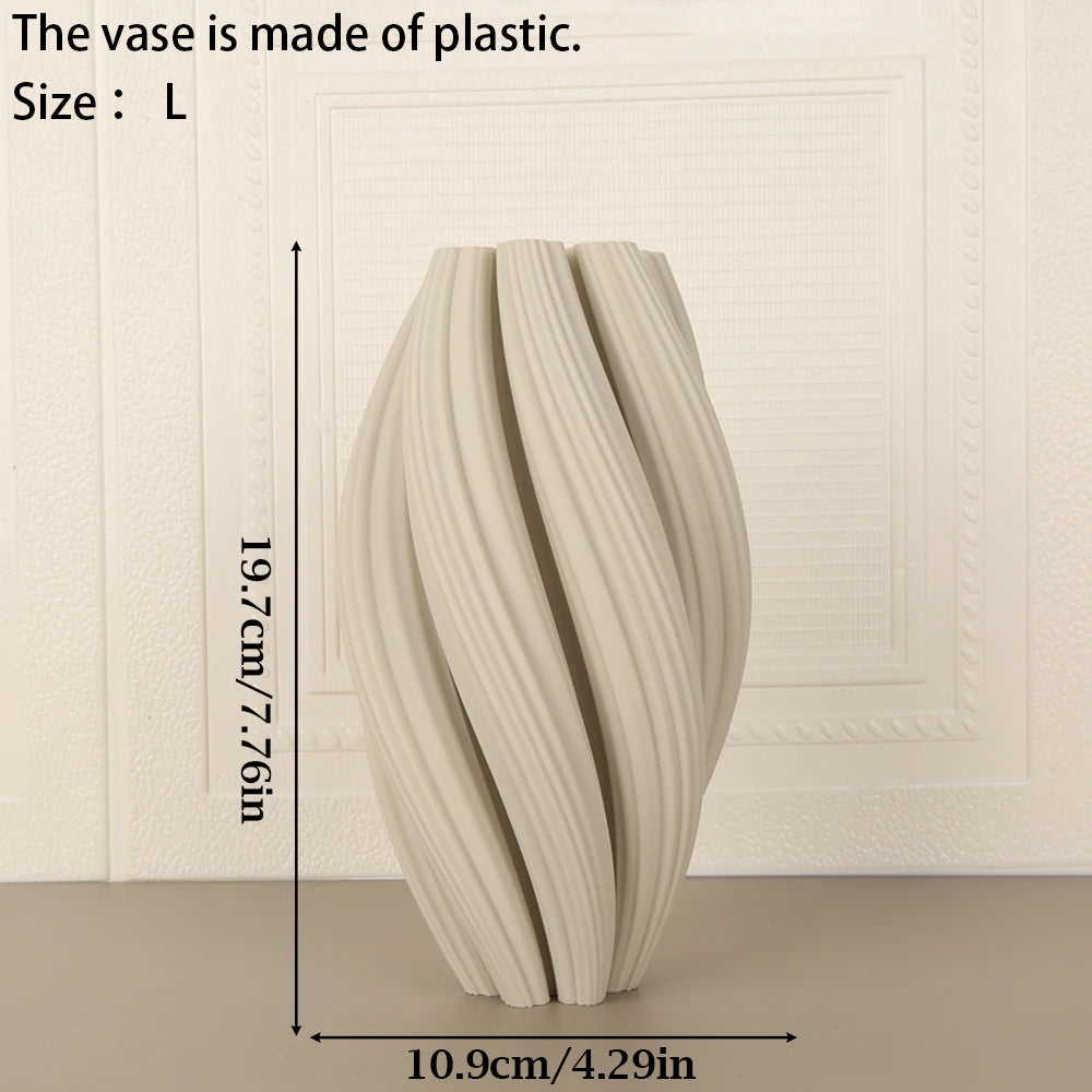 A tall, textured wave vase made of light-colored plastic is shown against a white background.