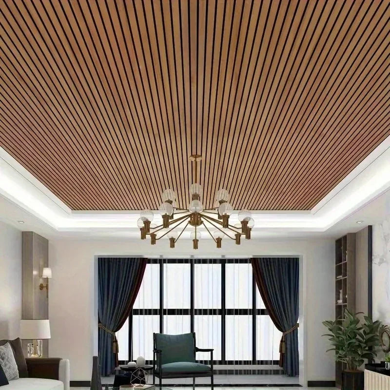 Interior view of a room featuring a ceiling panel design with vertical wood grain slats and a chandelier.