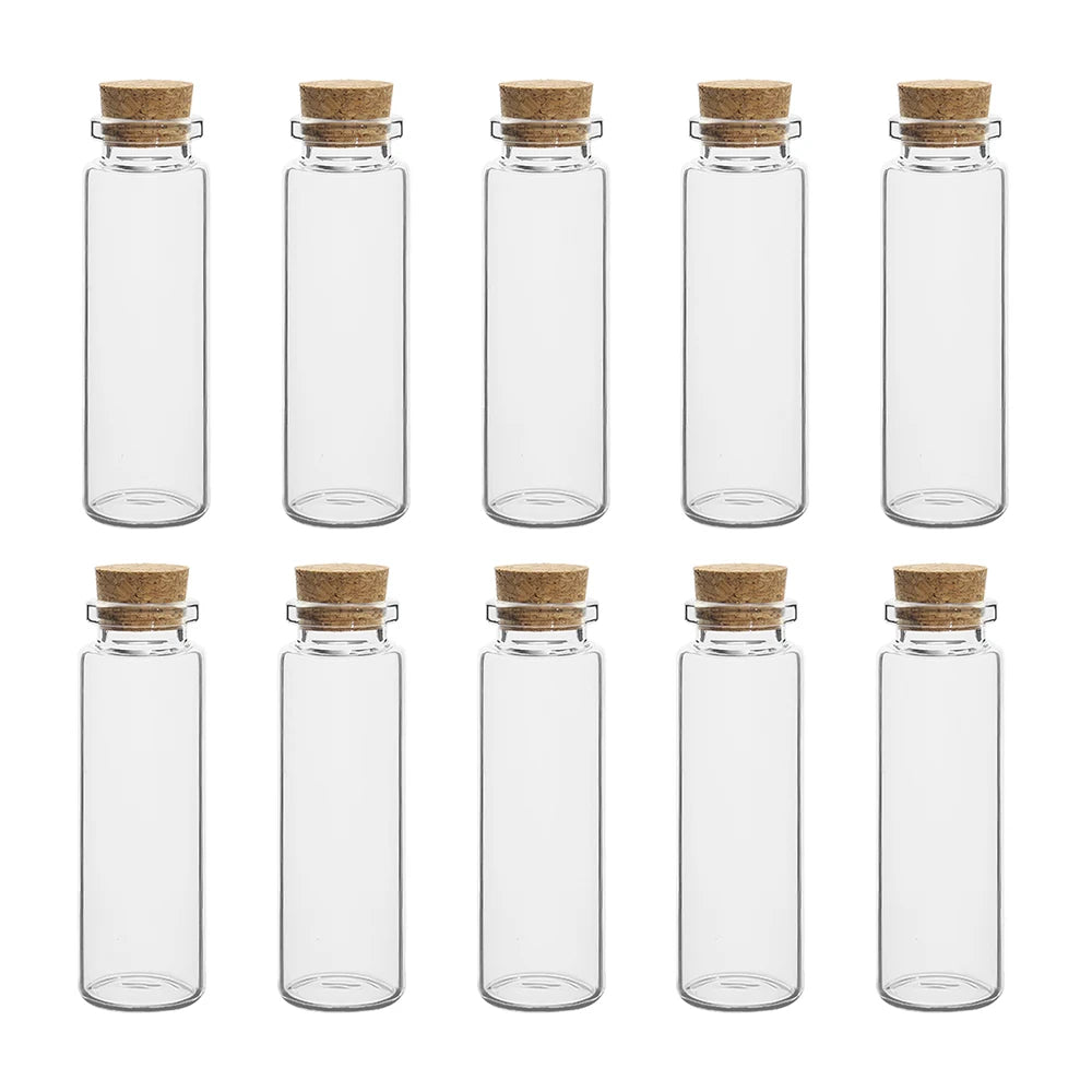 A set of clear glass vials with cork stoppers arranged in a row.