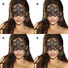 A close-up of a woman wearing an elegant black lace masquerade mask with dangling earrings.
