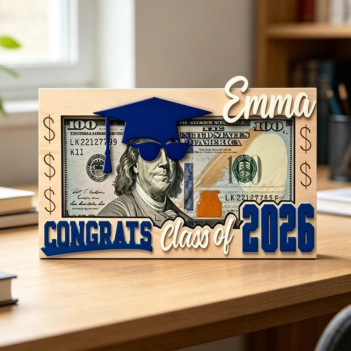A wooden sign featuring a graduation cap and sunglasses over US dollar bills with the text Congrats Class of 2026