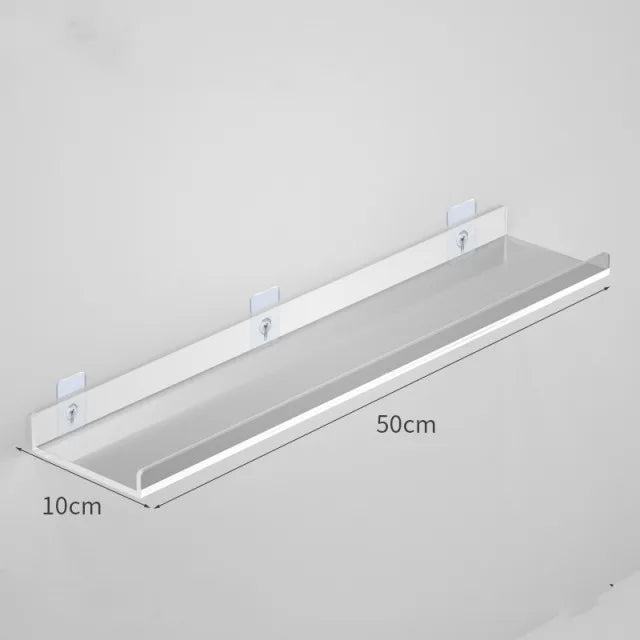 A white clear acrylic floating shelf with wall mounts shown in a profile view.