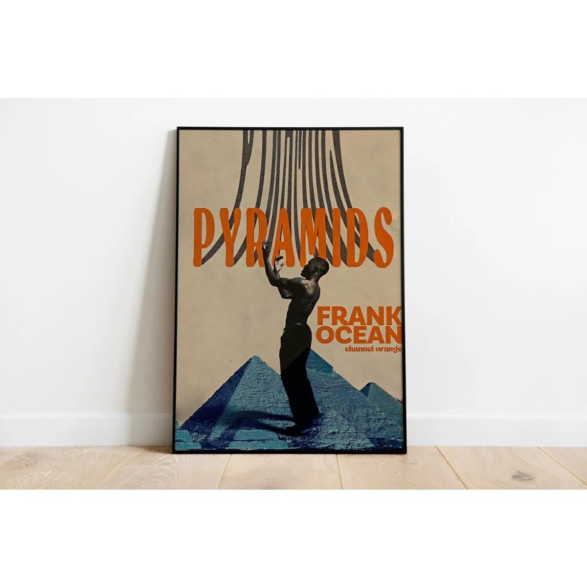 A canvas print featuring a silhouette of a person with long hair against a background of pyramids and orange text.
