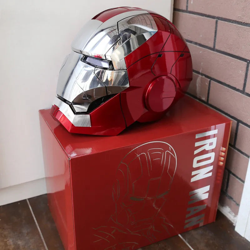 A red and silver Iron Man helmet is displayed on a red box.
