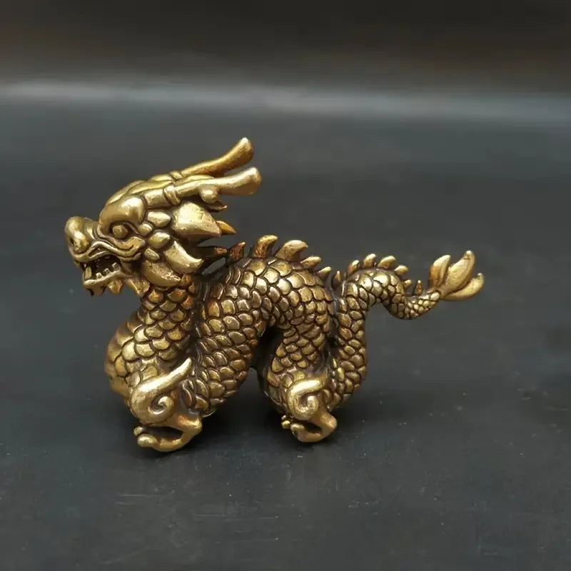 Handcrafted brass Chinese dragon statue with detailed scales and fierce expression.