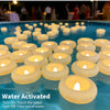 Water activated floating candles glowing warmly in blue water