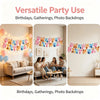 A decorative banner of colorful dog-themed paper flags strung across a wall for parties and photo backdrops.