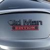A close-up of a silver car door featuring an Old Man Edition emblem on the side.