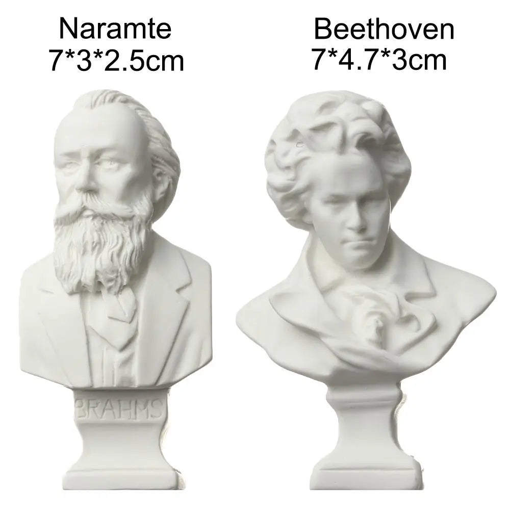 White plaster bust miniature of a bearded man, likely a historical figure, shown from the front and side.