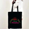 Black tote bag featuring a festive Christmas design with a wreath and the text Merry Christmas.