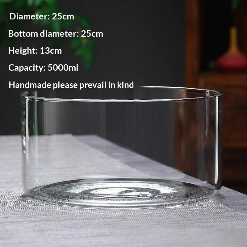 A clear glass container with a wide mouth is shown on a white surface, used for holding plants or moss.