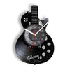 A black vintage vinyl record guitar wall clock with a circular face and a guitar silhouette design.