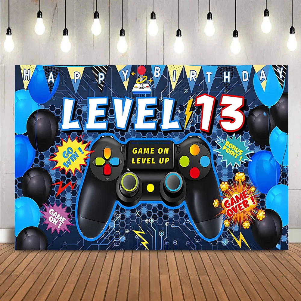 A vibrant party backdrop banner featuring a video game theme with a controller and balloons.