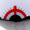 A handheld folding fan featuring a design resembling the flag of the United States, with white and red stripes.