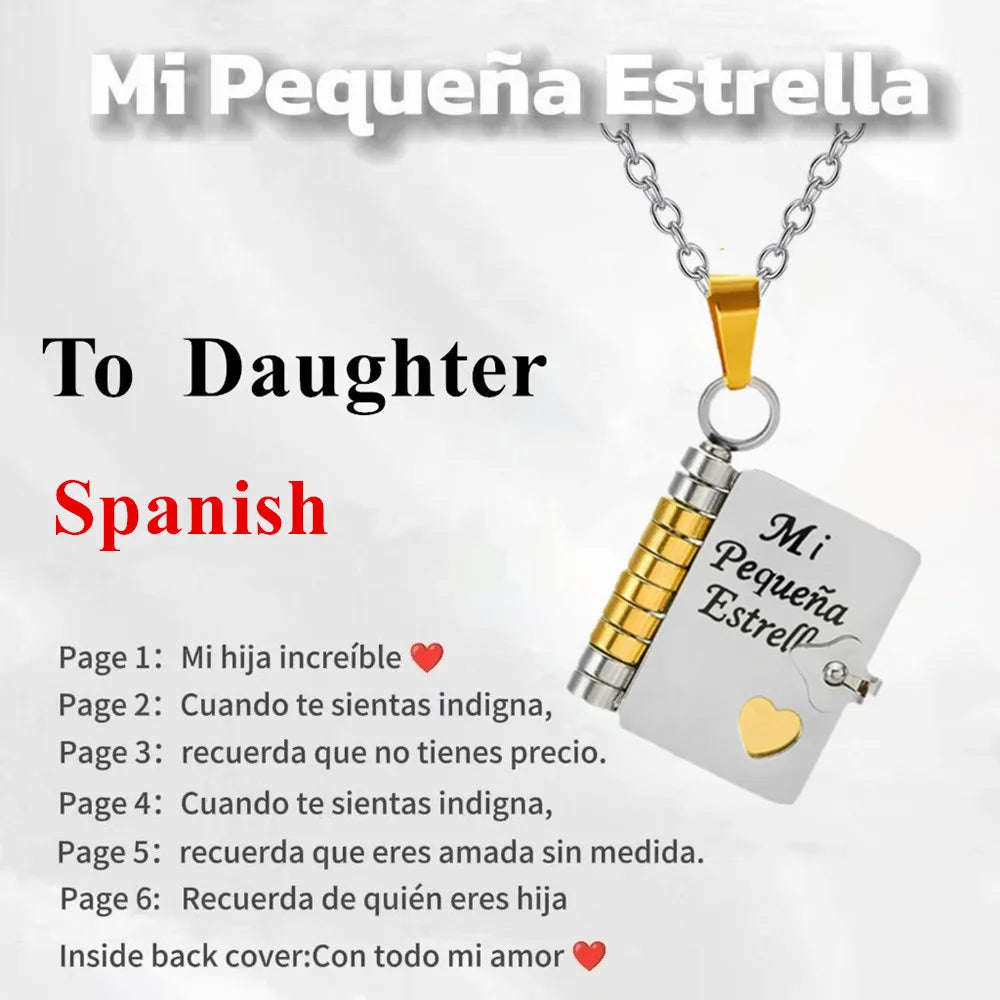 A gold chain necklace with a silver pendant engraved with a message for a daughter on a white card.