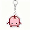 A pink pixel art charm of a Junimo character attached to a silver keychain ring.
