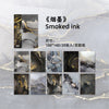 A pack of smoked ink decorative paper featuring marbled black and white tones with gold accents.