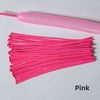 Pink latex strip balloons laid out on a white surface.