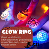 Hands hold glowing LED rings featuring Halloween designs like a pumpkin, ghost, and spider for party favors