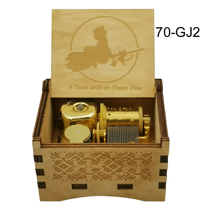 A wooden music box with a lid featuring a silhouette of a figure and the text A Town with an Ocean View