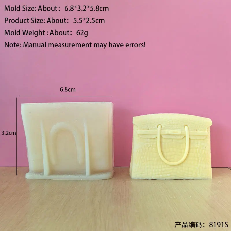 A rectangular silicone mold shaped like a handbag is shown against a pink background.