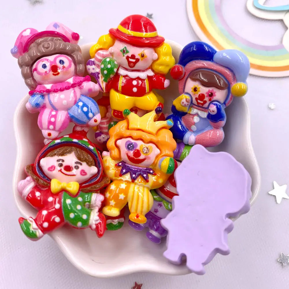 A collection of colorful kawaii clown resin charms for DIY crafts and scrapbooking
