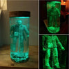 A collectible lamp featuring a Jason Voorhees figure submerged in glowing green liquid inside a glass container.