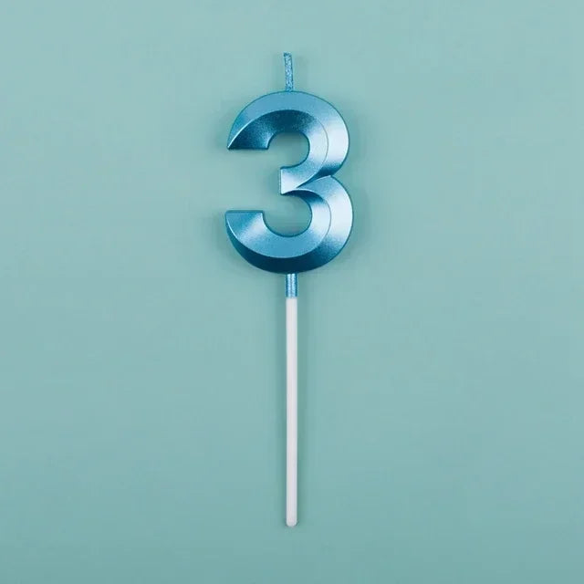 A blue number three candle with a white stick against a light teal background.