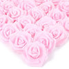 A dense arrangement of pink artificial foam rose decorations.