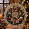 A large, ornate Christmas wreath made of glitter and fabric is displayed against a blurred holiday background.