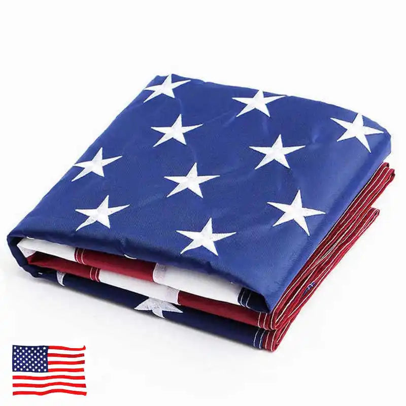 A folded blue and white star American flag with red stripes and brass grommets.