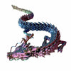A detailed resin figurine of a conjoined dragon ornament with scales in shades of blue and purple.