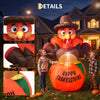 A large orange inflatable pumpkin turkey with LED lights is displayed outdoors in a garden setting.
