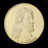 A gold-plated commemorative coin featuring a profile portrait of Jesus Christ with long hair and beard.