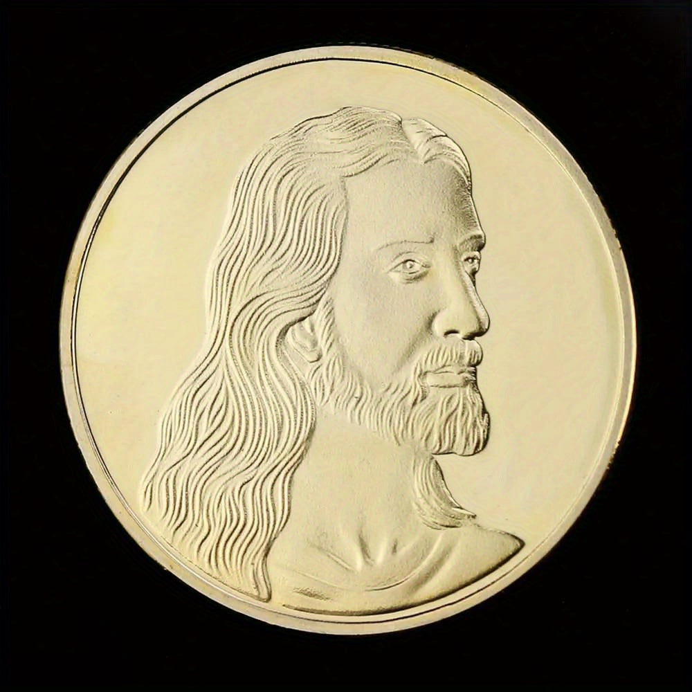 A gold-plated commemorative coin featuring a profile portrait of Jesus Christ with long hair and beard.