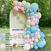 A balloon garland kit featuring pink, blue, and white balloons arranged on a vertical sign.