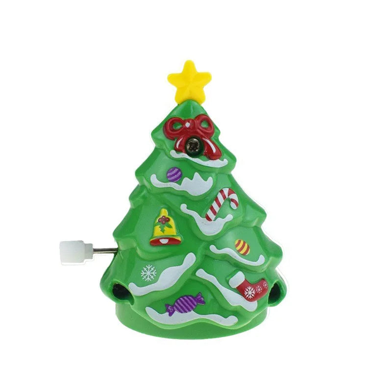 A green Christmas tree figurine with a yellow star topper and festive decorations.