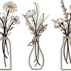 Set of three rustic metal flower arrangements in glass vases with dried grasses and flowers