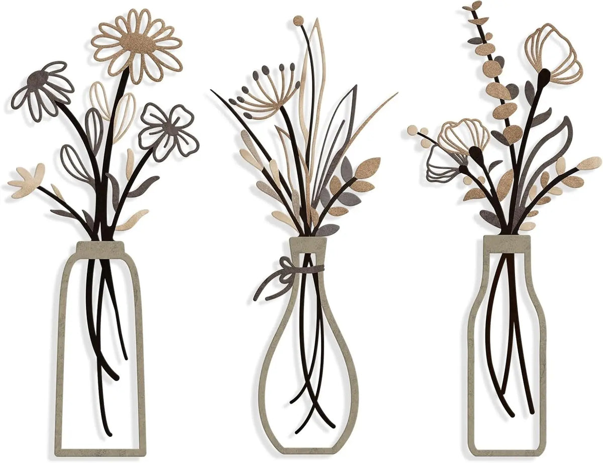 Set of three rustic metal flower arrangements in glass vases with dried grasses and flowers