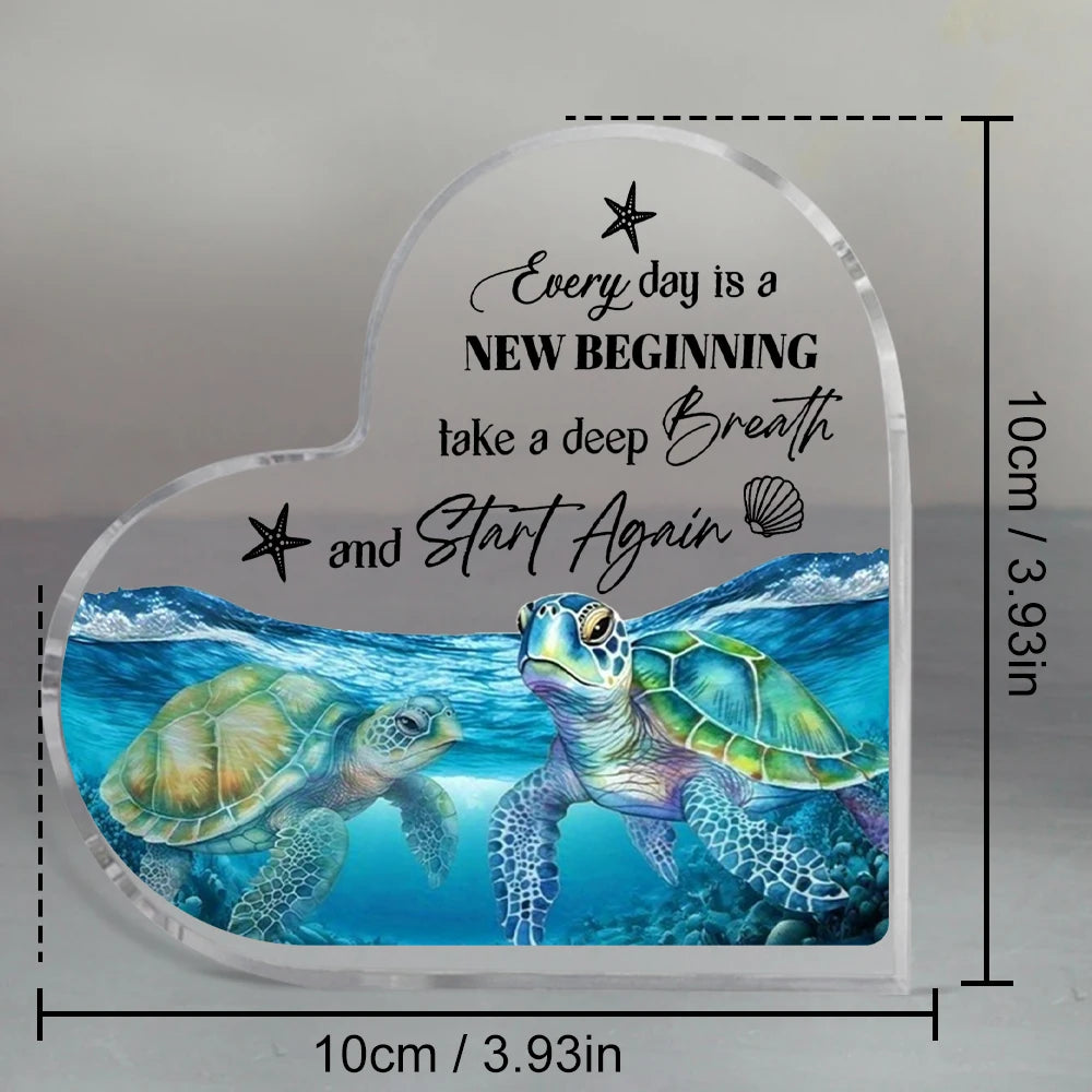 Clear acrylic heart-shaped decor featuring a blue sea turtle swimming underwater.