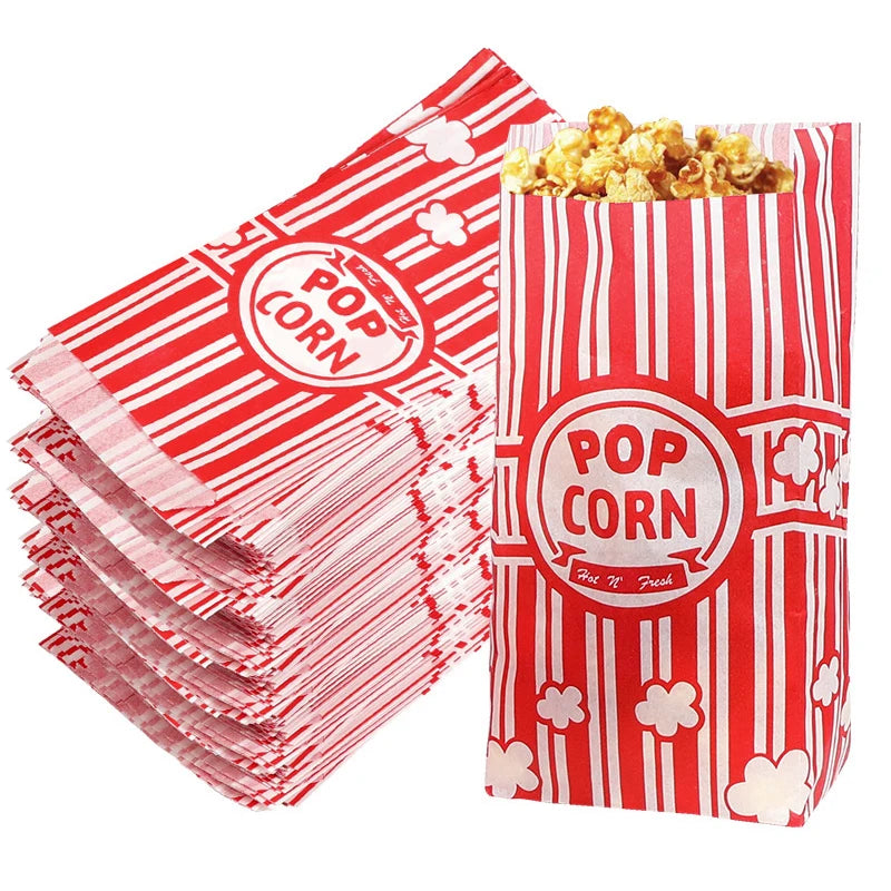 Red and white striped popcorn bags filled with popcorn for parties and events