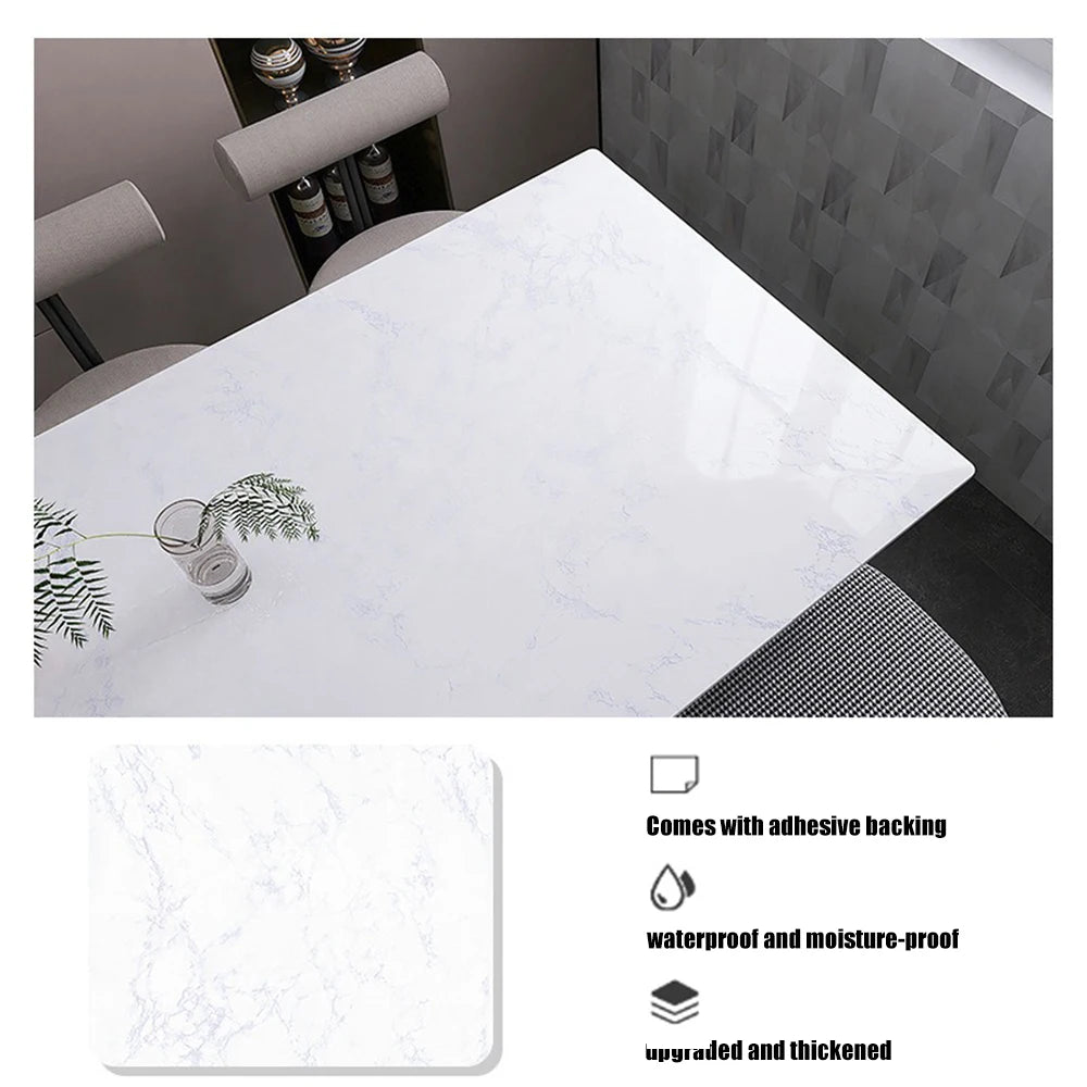 A white marble pattern self-adhesive backsplash panel shown in a kitchen context.