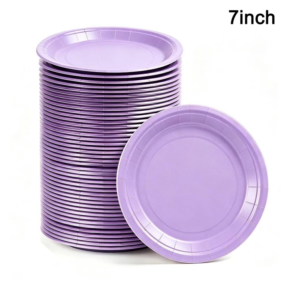 A stack of purple 7-inch disposable paper plates, including one plate lying separately.