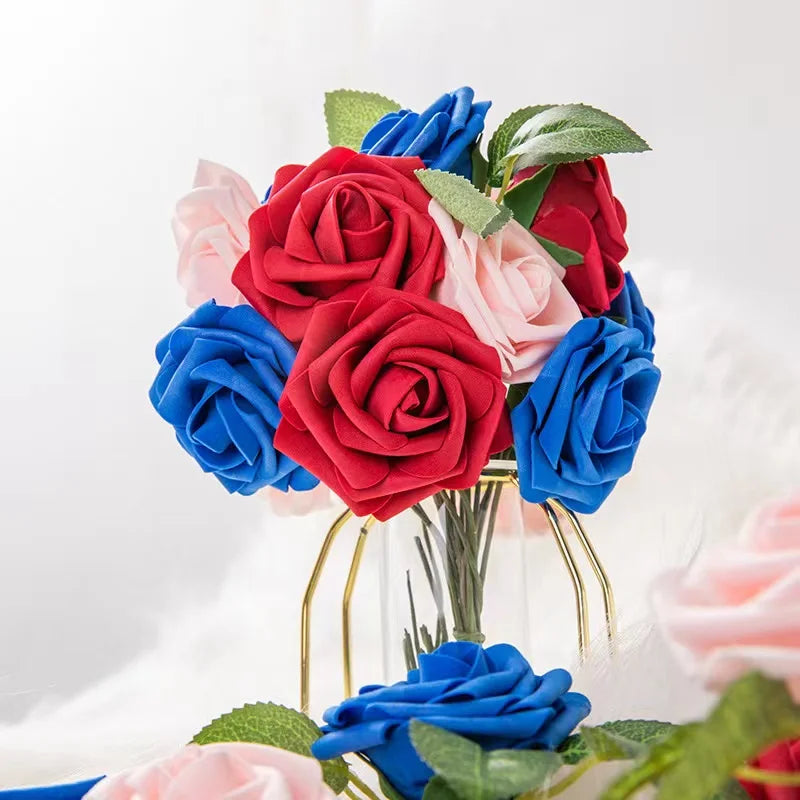 A bouquet of realistic foam roses in shades of red, pink, and blue with green leaves.