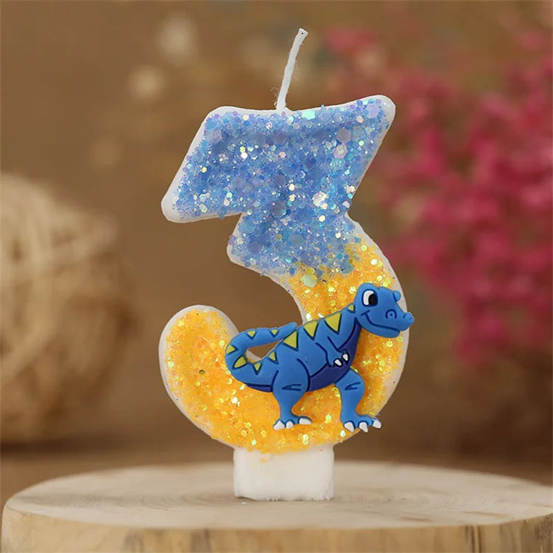 A birthday candle shaped like the number 3, featuring a blue dinosaur design on an orange background.