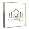 A framed print featuring a depiction of the greatest gift of all from Matthew 1:21 with figures in robes.