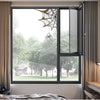 A window with a spider web decoration visible through the glass.